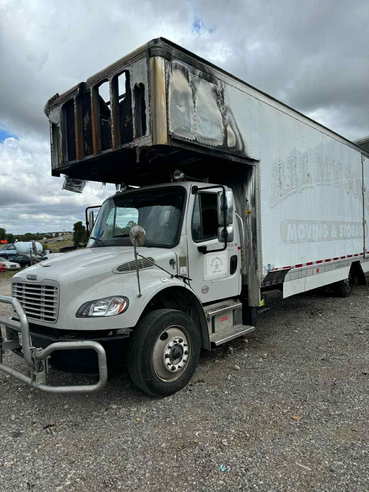 Professional technician performing trailer roof sealing and repair